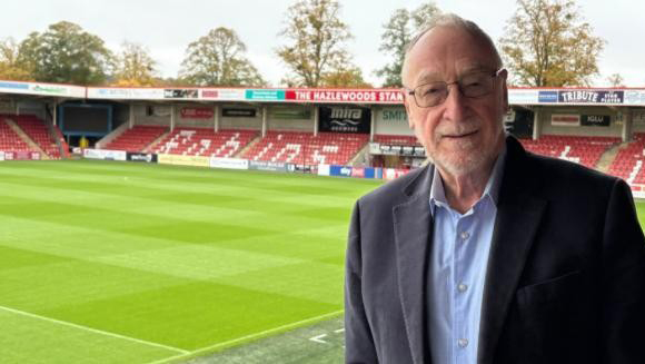 Cheltenham Town fan Adrian Bailey will swim 80 lengths on his 80th birthday to raise funds for the Cheltenham Town Community Trust