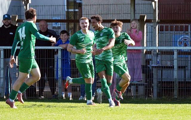 Jacob Rodgers, second from right, celebrates after scoring the goal that clinched the Hellenic League Premier Division title for Slimbridge. Picture, Brian Rossiter