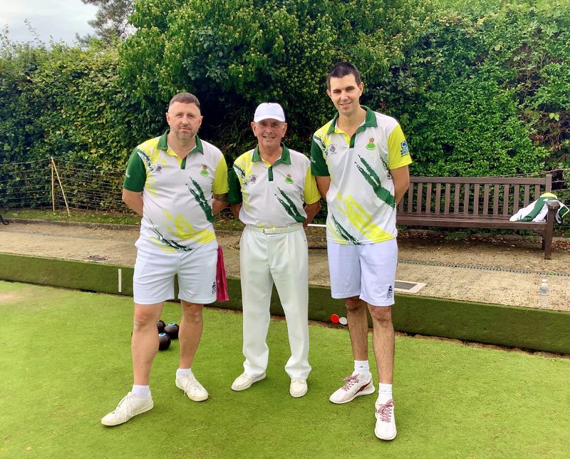 Leading Barnwood players Richard Browett, left, and Chris Roach, right, with umpire John Jones