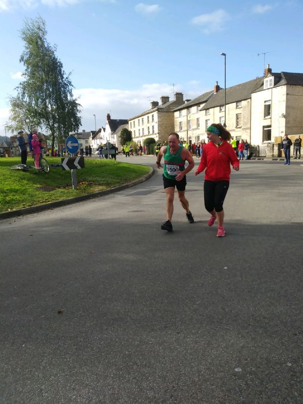 Jeff Waters shows his determination to finish the Stroud Half Marathon assisted by his daughter Rebecca