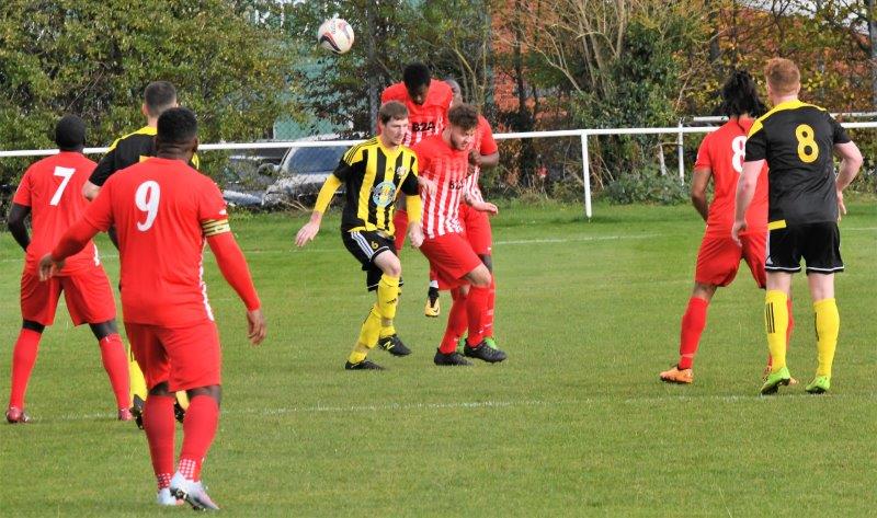 Action from the game between Gala Wilton (yellow and black) and Lebeq United