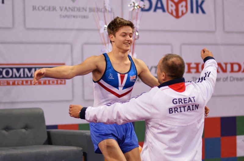 Kristof Willerton celebrates at the world championships in 2013 with national coach Craig Lowther