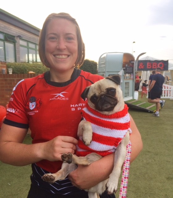 Megan Goddard with her pet pug Gwen dressed in a Gloucester-Hartpury shirt