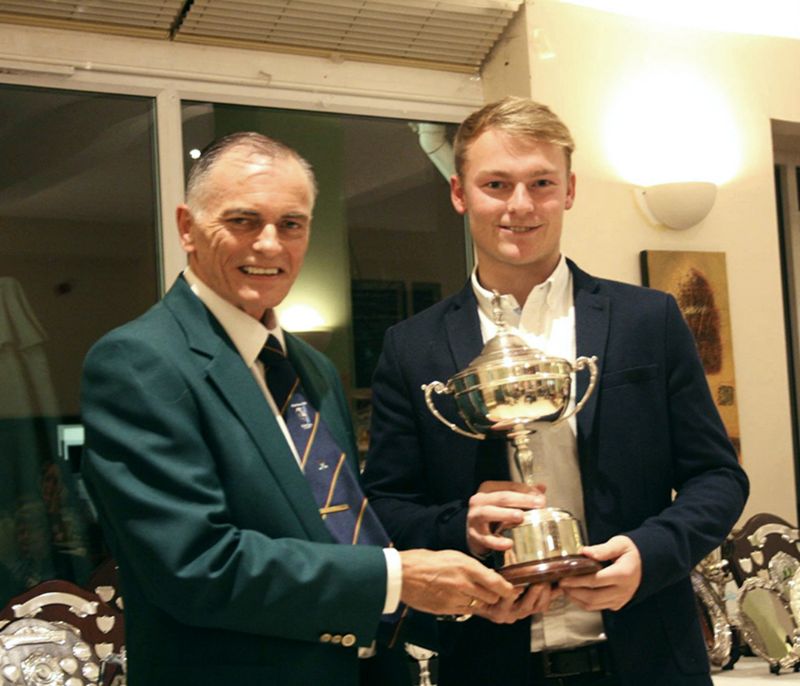 Sean Bailey, left, presents club champion Dan Hall, 20, with his trophy