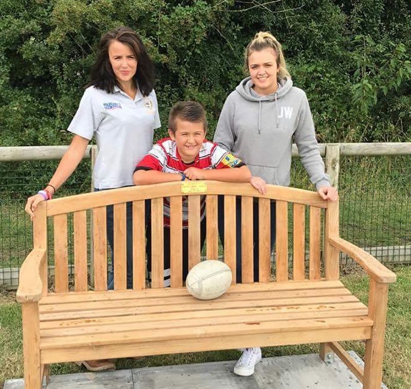 Alfie Roberts with sisters Rebecca and Louise at a bench donated in Martin’s name by Wooden Spoon