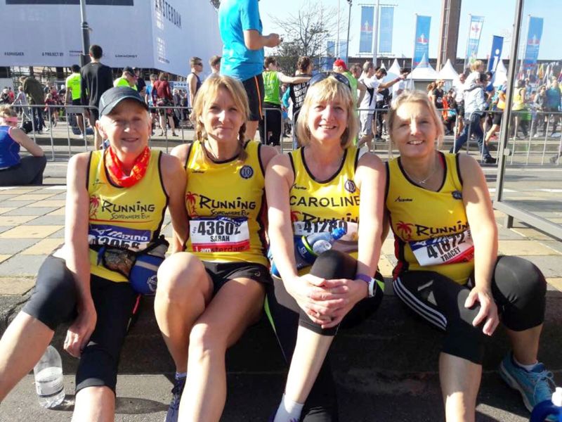 Sarah Gray, second from left, with fellow Running Somewhere Else members, from left, Kate Potter, Caroline Coates and Tracey Pitts at the start of the Amsterdam Half Marathon in October