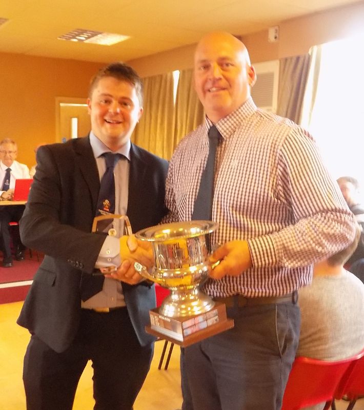 Ian Swales, Cheltenham League referee secretary, presents the referee of the year award to Graham McNulty, right