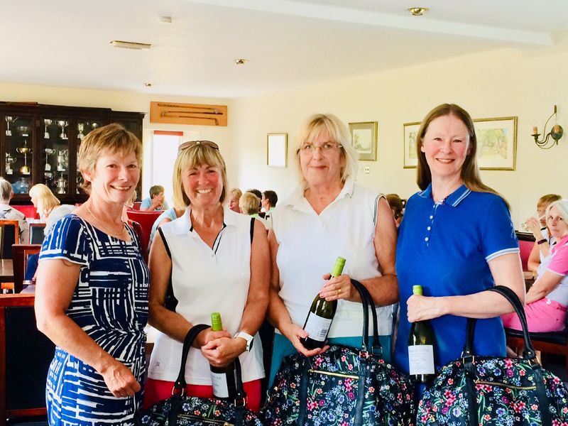 The winning team from The Worcestershire – C Goody, J Musson and J Saunders -being presented with their prize by Linda Seaton

