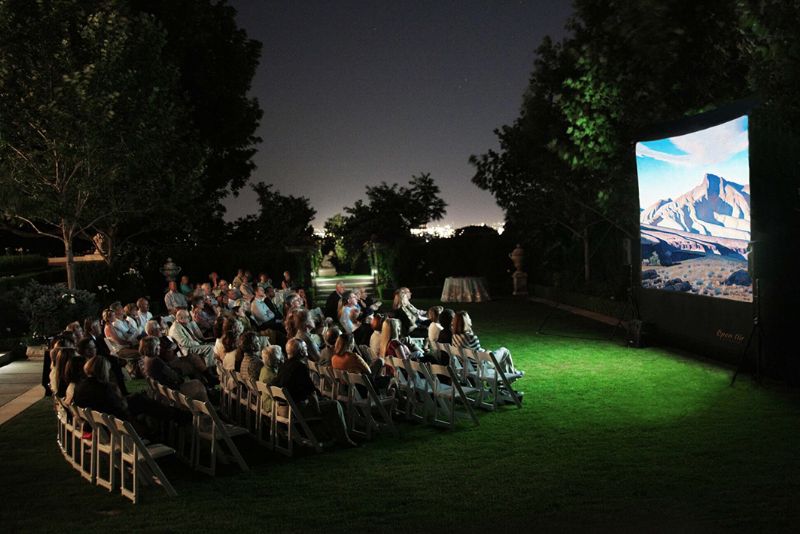 Audiences enjoying the outdoor cinema experience.