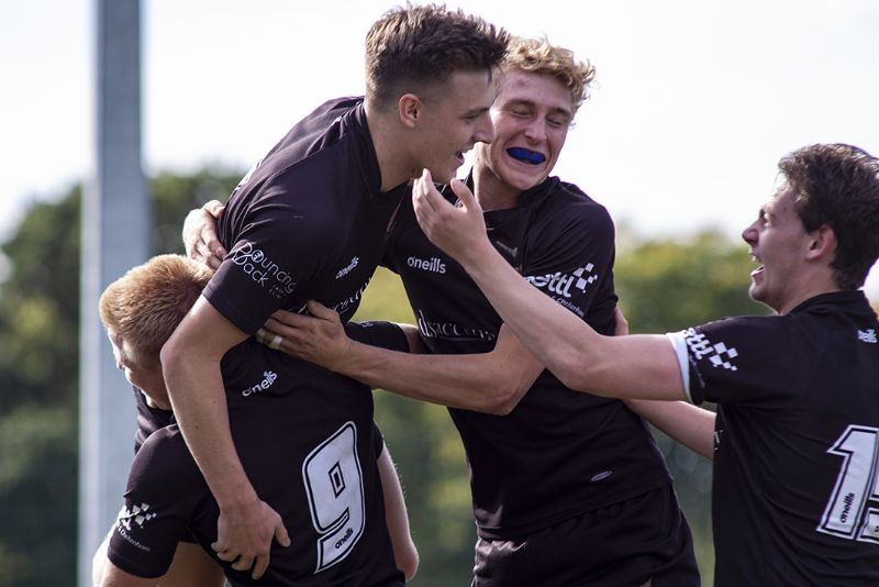 All Golds celebrate with try scorer Callum Merrett. Picture, Lewis Mitchell
