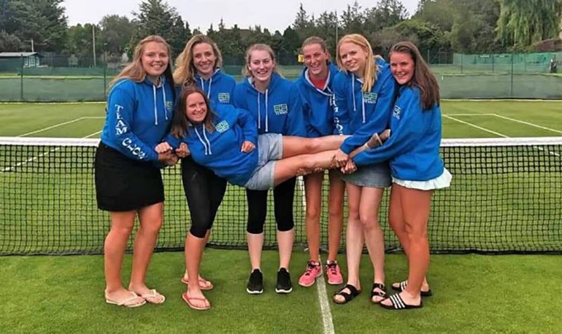 Gloucestershire’s tennis team, from left, Eleanor Findlay, Sophie Brazell, Jenny Eales, Laura Eales, Lily Owen and Charlotte Russell celebrate withp team captain Esther Curtis. Olivia Rook was also in the squad