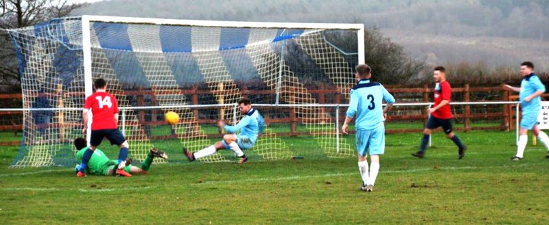 Action from Ruardean Hill Rangers v Frampton United, a game Frampton, in red, won 4-1