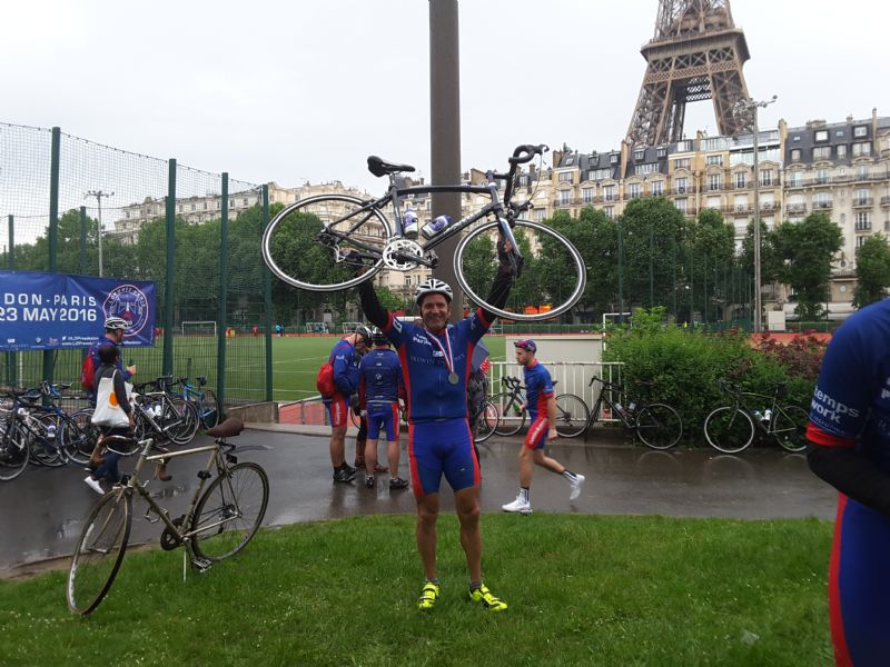 Jason Eaton in front of the Eiffel Tower after completing last year’s London to Paris charity cycle ride