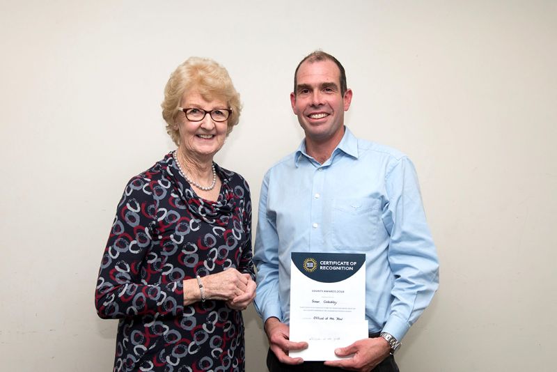 Simon Corbishley receives his award from the Gloucestershire LTA. He is pictured with Cathie Sabin, who was the first woman to hold the position of president of the Gloucestershire LTA
