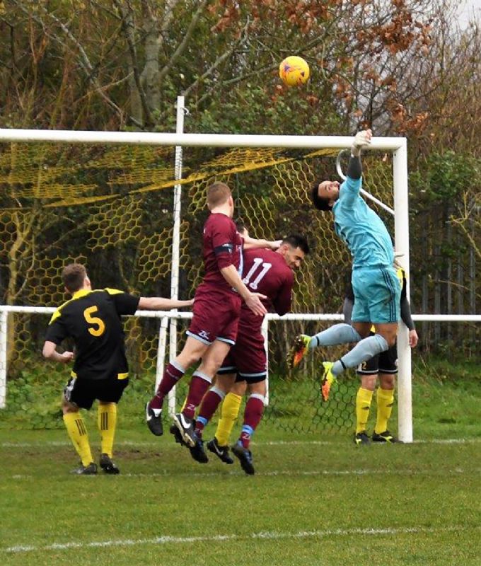 Gala Wilton goalkeeper Lewis Skyers in the thick of the action against Broadwell Amateurs. Picture, Pete Langley