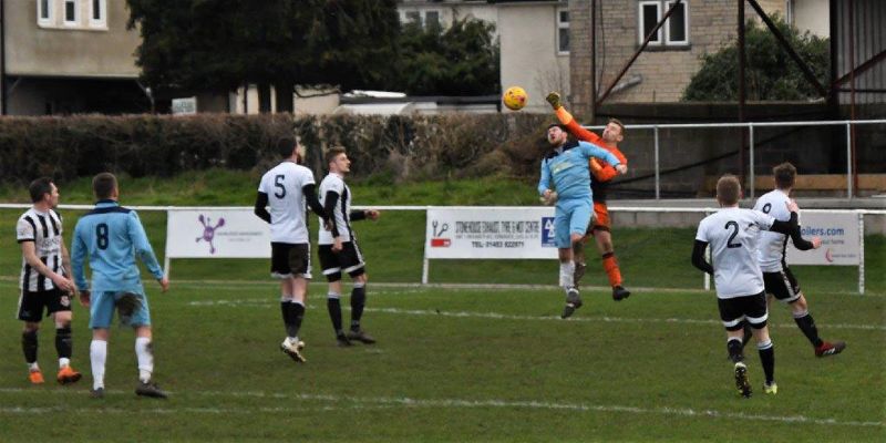 Stonehouse goalkeeper Will Pedrick under pressure against Ruardean Hill Rangers. Picture, Pete Langley