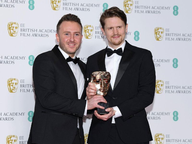 Oliver Walton (left) and Alex Lockwood (right) on the red carpet after receiving the BAFTA