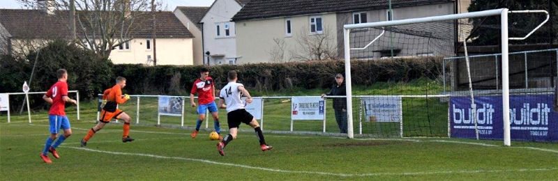 Action from Stonehouse Town v Frampton United. Frampton are in red.