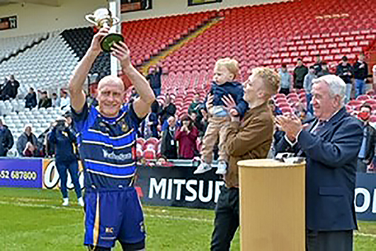 Rod Creese lifts the Glanville Cup at Kingsholm on Saturday. Picture, Shaun Lafferty