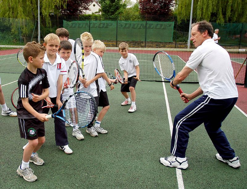Nailsworth Tennis Club coach Phil Sims with the juniors