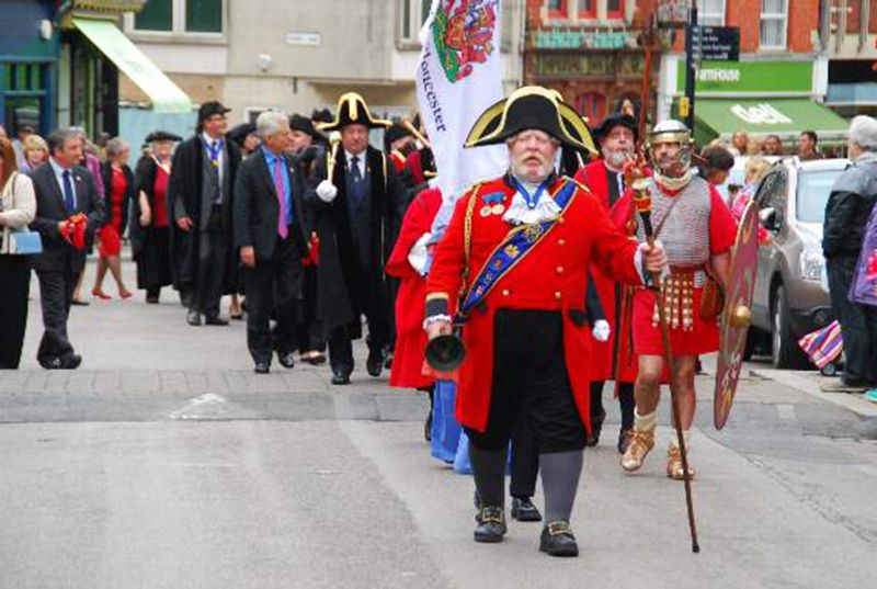 Alan Myatt leads the Gloucester Day parade