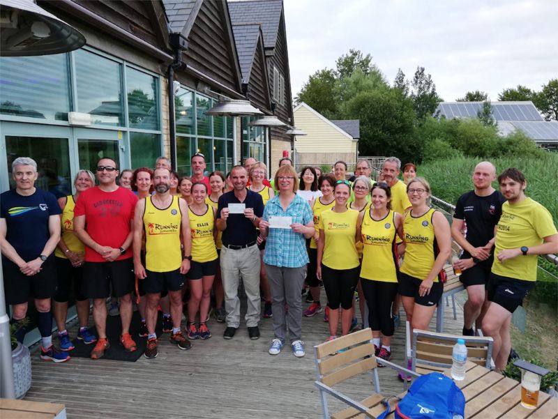 Running Somewhere Else have presented  a cheque for £2,540 to local charity Cirencester Signpost