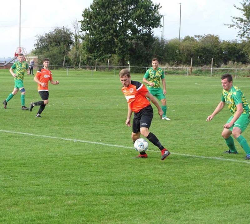 Stu Midwinter closely watched by Lewis Driscoll. They were both goalscorers in the 4-0 win at Berkeley Town on Saturday