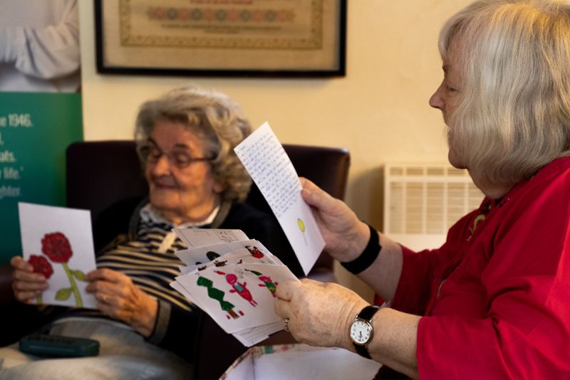 Some of Lilian Faithfull's residents reading the cards sent to them