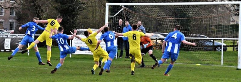 Action from Frampton United (in blue) against Wick. Picture, Pete Langley