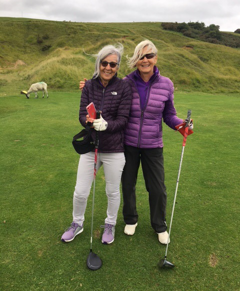 Barbara (right) and a friend playing golf