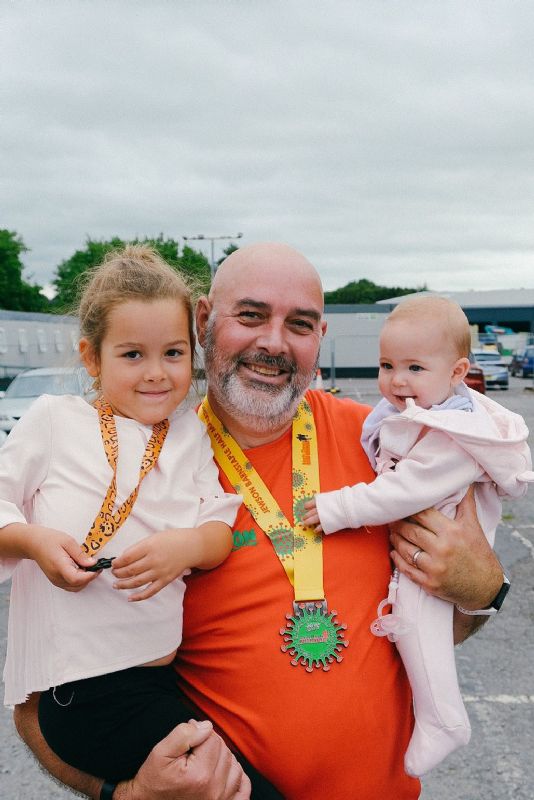 Cam Pay with grandchildren Amelia and Olivia after completing the Barnstaple Half Marathon in 2021