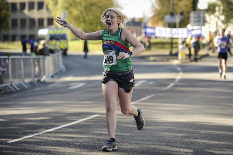 Charlie Gorman running the Stroud Half Marathon in 2019, her first race in a Stroud AC vest