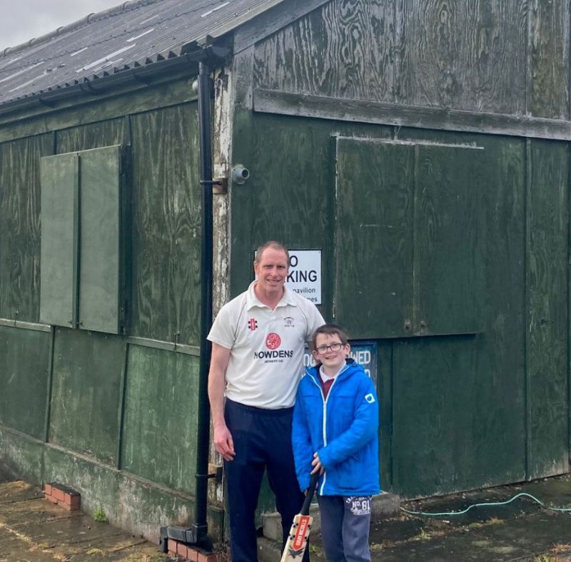 Ross Wakely, pictured with his son and junior player Charlie, outside Whitminster’s pavilion
