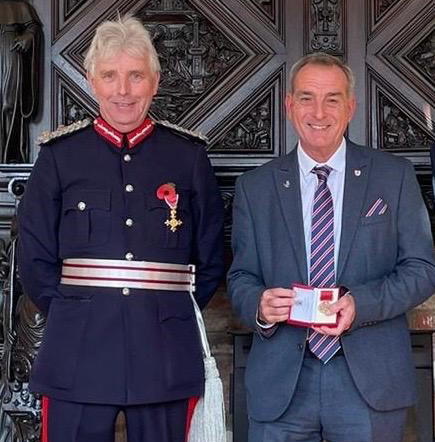 Stuart Langworthy with, left, Edward Gillespie, the Lord Lieutenant of Gloucestershire, after receiving his British Empire Medal