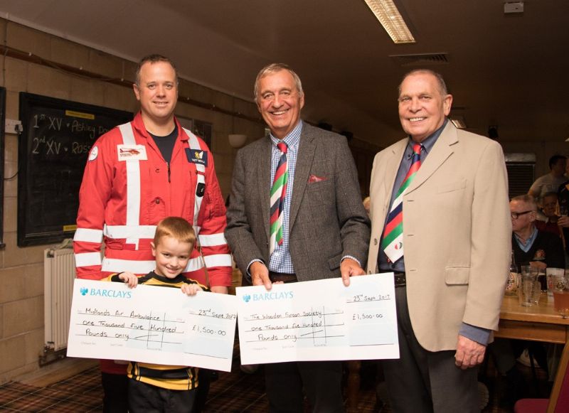 Matt Boylan, left, of Midlands Air Ambulance with Tim Heal, centre, and Paul Hipkiss of The Wooden Spoon Society. Also pictured is Matt’s son Billy, 7, who is part of Tewkesbury RFC’s junior set-up